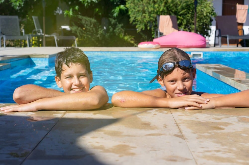 Children standing on pool